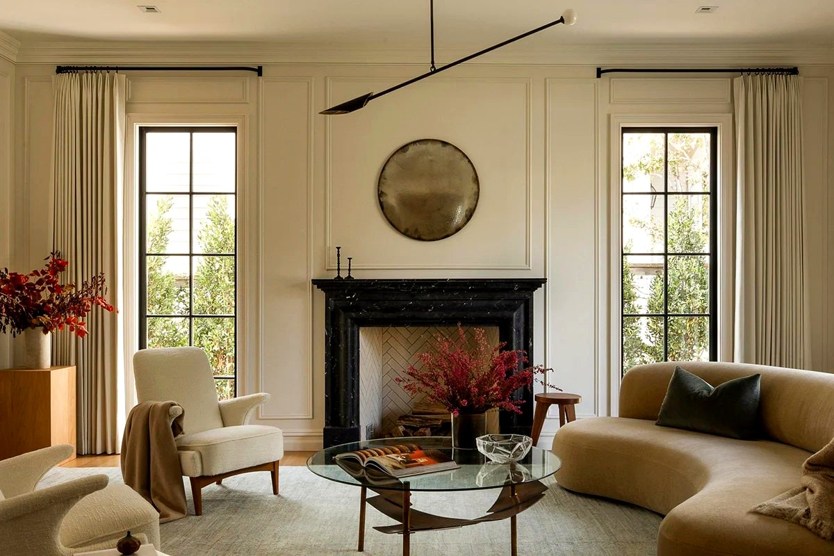 Custom drapery panels framing windows in an elegant living room
