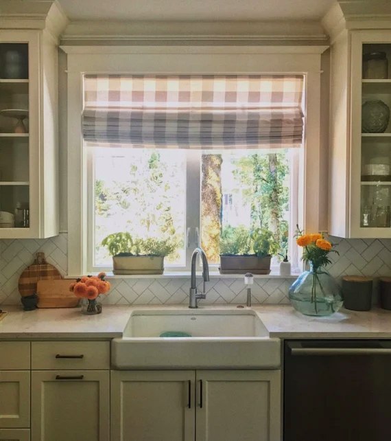 Plaid roman shade over kitchen sink