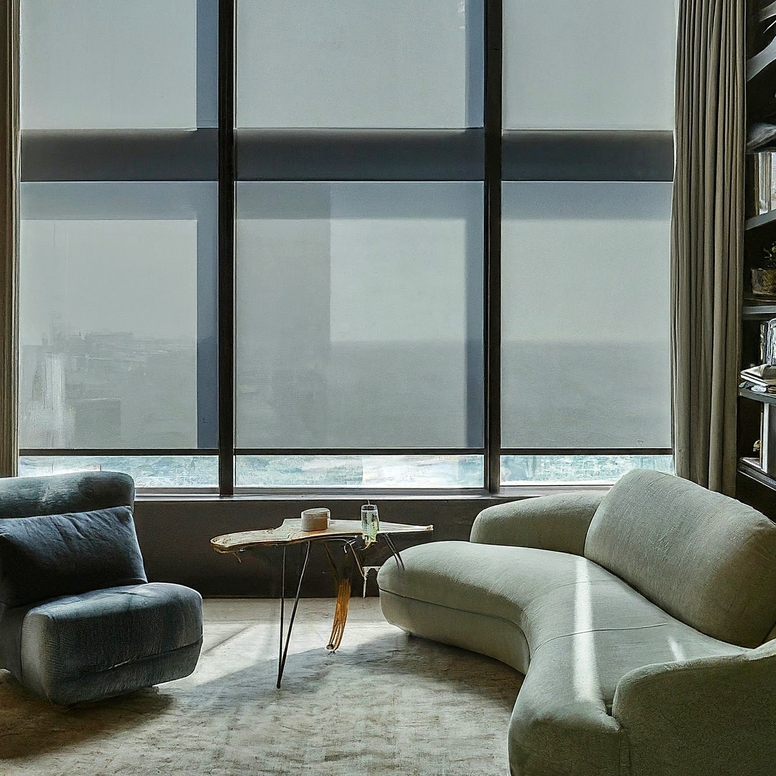 Elegant living room with custom roller shades