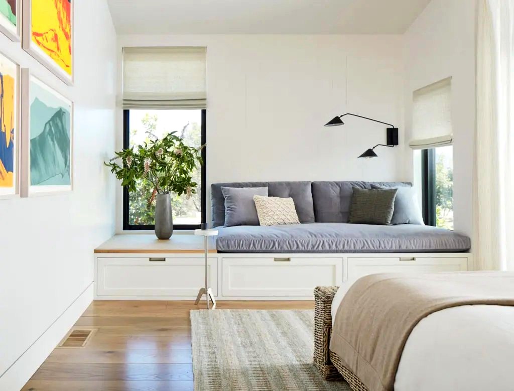 Soft folded roman shades in a serene bedroom